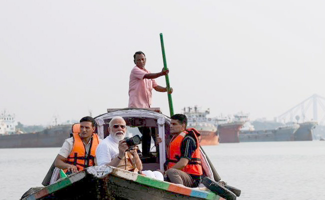 PM takes boat ride on Hooghly river in Kolkata, says committed to prosperity of Bengalis